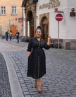Black midi dress with tie waist and button-front, long sleeves