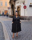Black midi dress with tie waist and button-front, front view