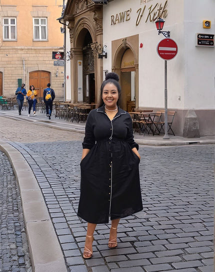 Black tie-waist button-front midi dress with long sleeves and collared neckline