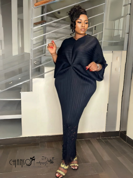Black knit maxi dress with V-neck, twist-knot waist, ribbed knit and long hem