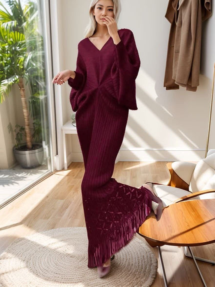 Maroon knit maxi dress with V-neck, long loose sleeves, ribbed knit, tassel hem