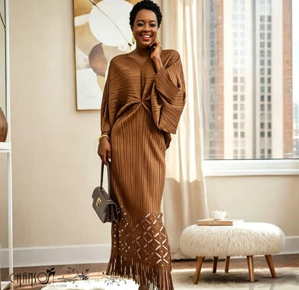 Brown knit maxi dress with V-neck, long loose sleeves, ribbed knit, tassel fringe hem