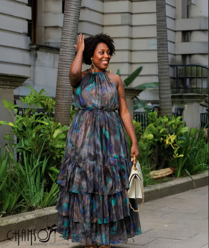 Halter maxi dress with abstract swirl print, elastic waist, tiered ruffle skirt.