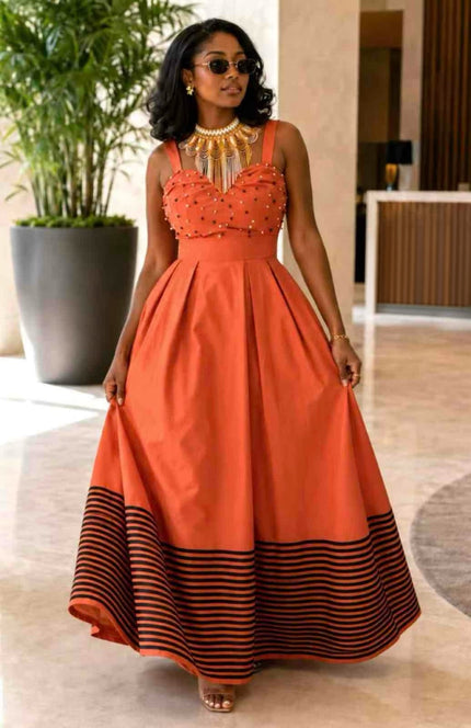 Orange beaded bodice sleeveless maxi dress with striped hem