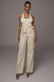 Cream cargo pant and halter vest twin set with flap pockets and sleeveless cut