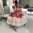 Pleated midi dress with puff sleeves, red and white with yellow and purple stripes