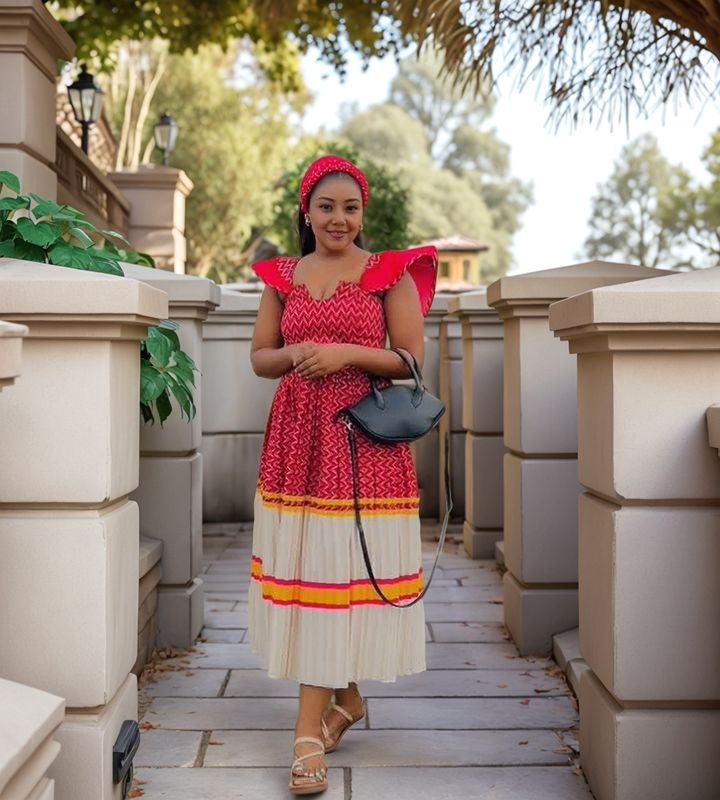Ethnic midi dress with red chevron print, ruffle sleeves, layered hem and cream skirt