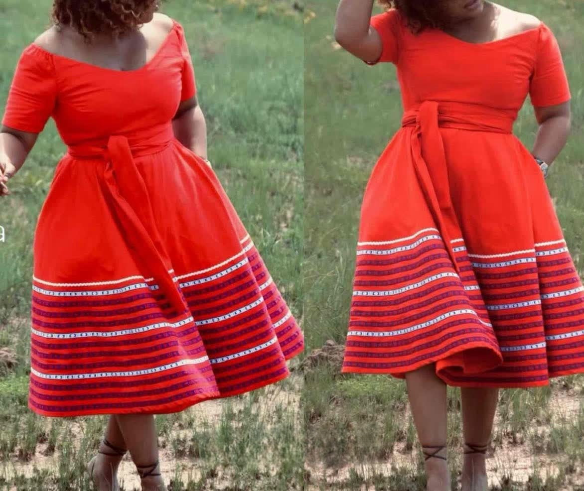 Plus size A-line dress in red with short sleeves and striped hem, gathered waist tie.