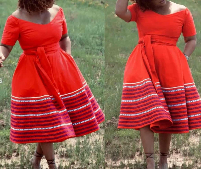 Plus size A-line dress in red with short sleeves and striped hem, gathered waist tie.