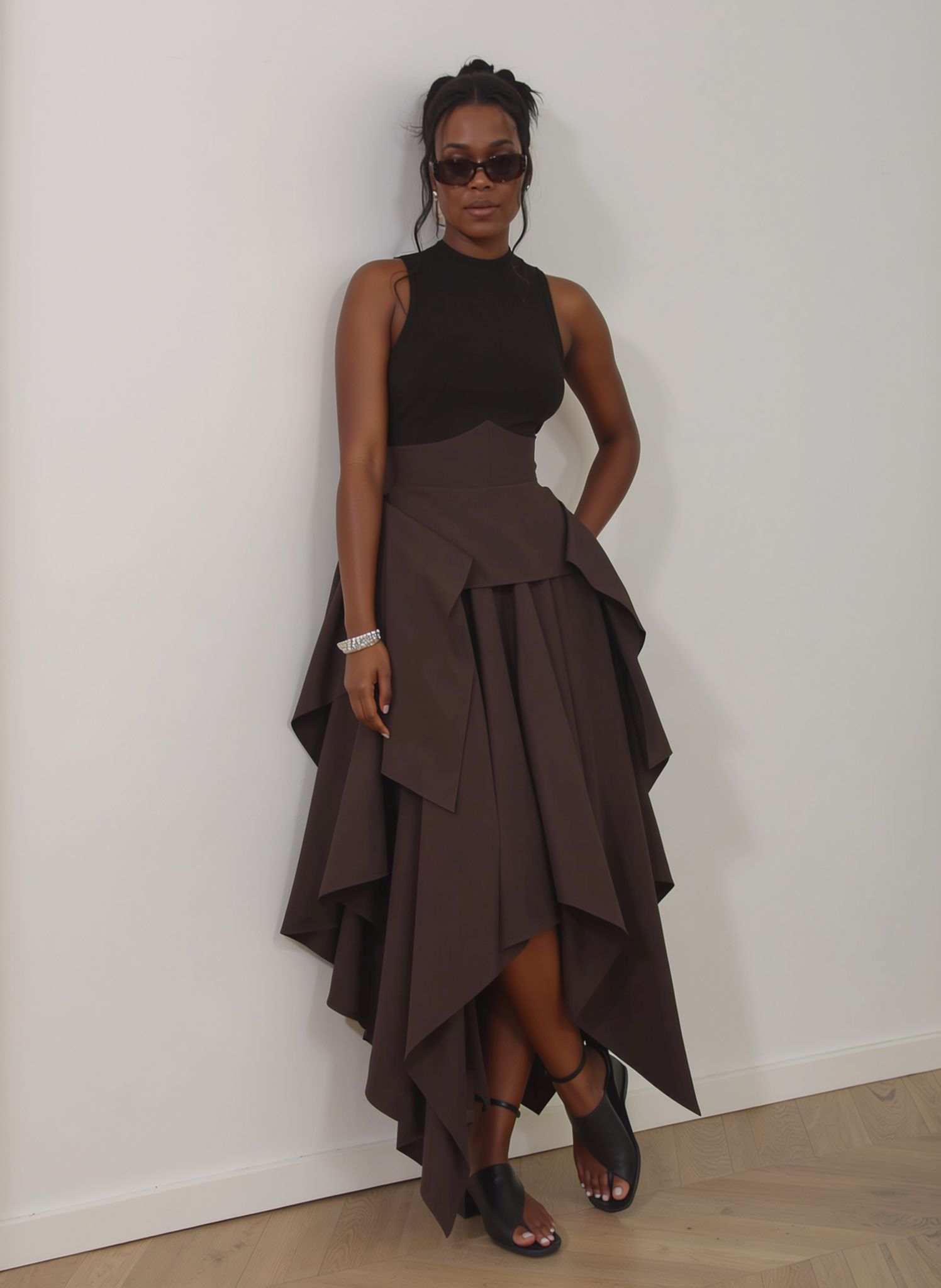Coffee two-piece set with sleeveless high-neck top and high-waist asymmetric hem skirt