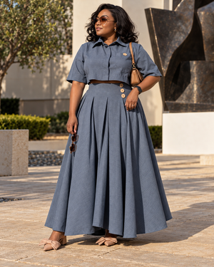 Blue-gray two-piece outfit with cropped shirt and pleated maxi skirt with button details