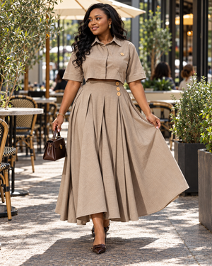 Khaki two-piece outfit with cropped shirt and flowing pleated maxi skirt