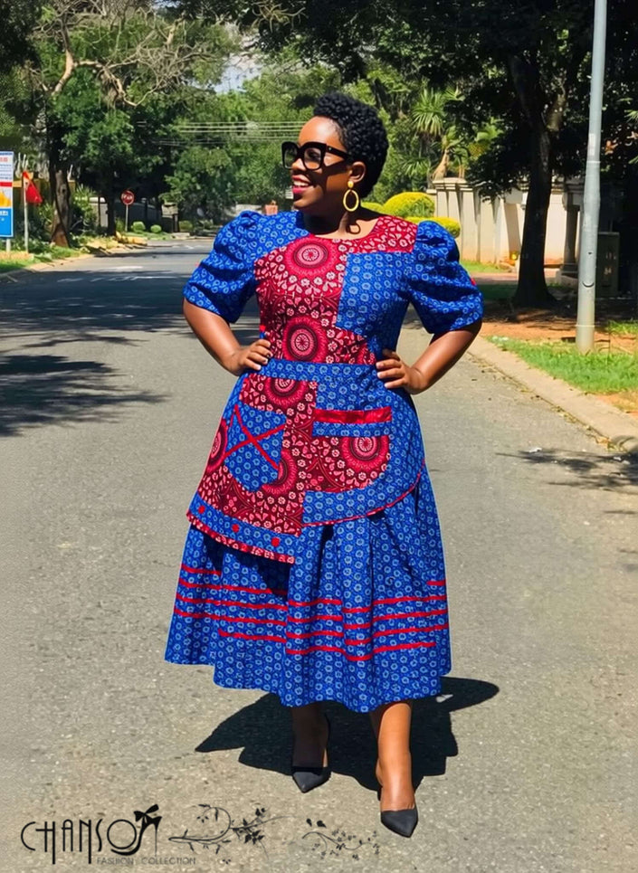 Geometric patchwork traditional dress in blue, pink and white, puff sleeves, midi length