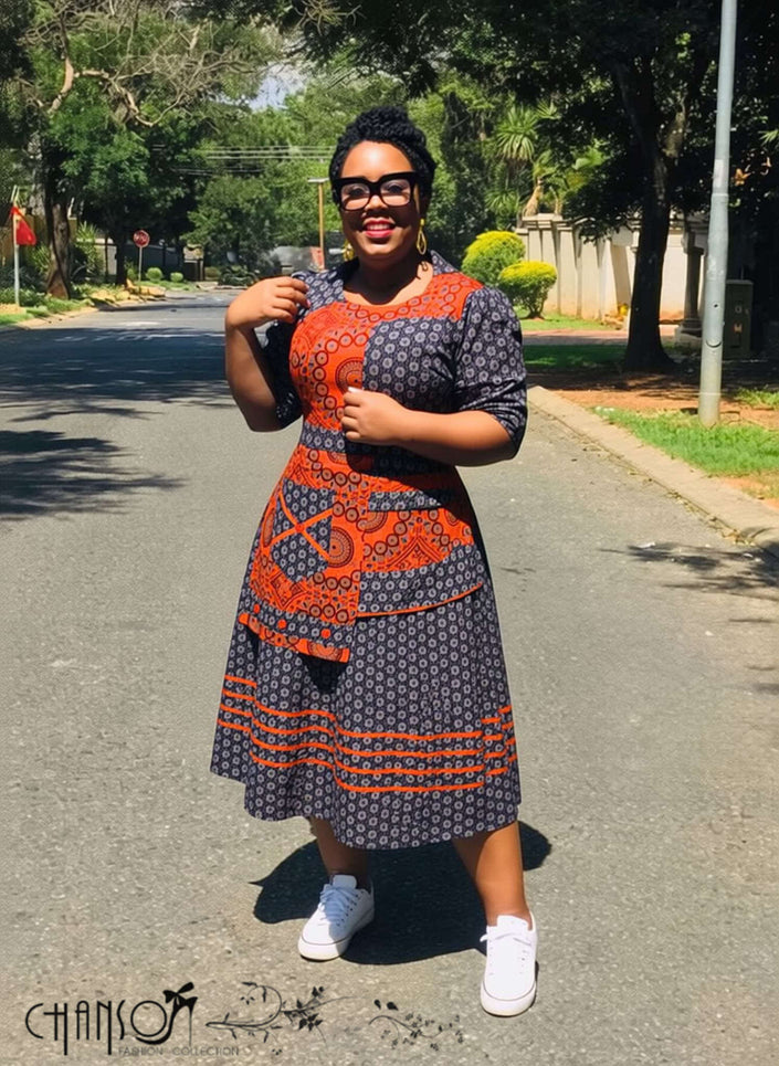 Geometric patchwork traditional dress in navy, orange and cream, short sleeves, midi length