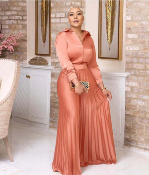 Pink pleated skirt twin set with long-sleeve buttoned top, elastic waist