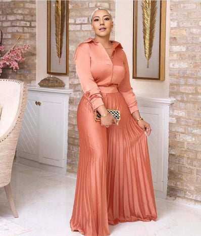 Pink pleated skirt twin set with long-sleeve buttoned top, elastic waist