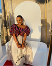 Puff sleeve patterned top and white pleated skirt