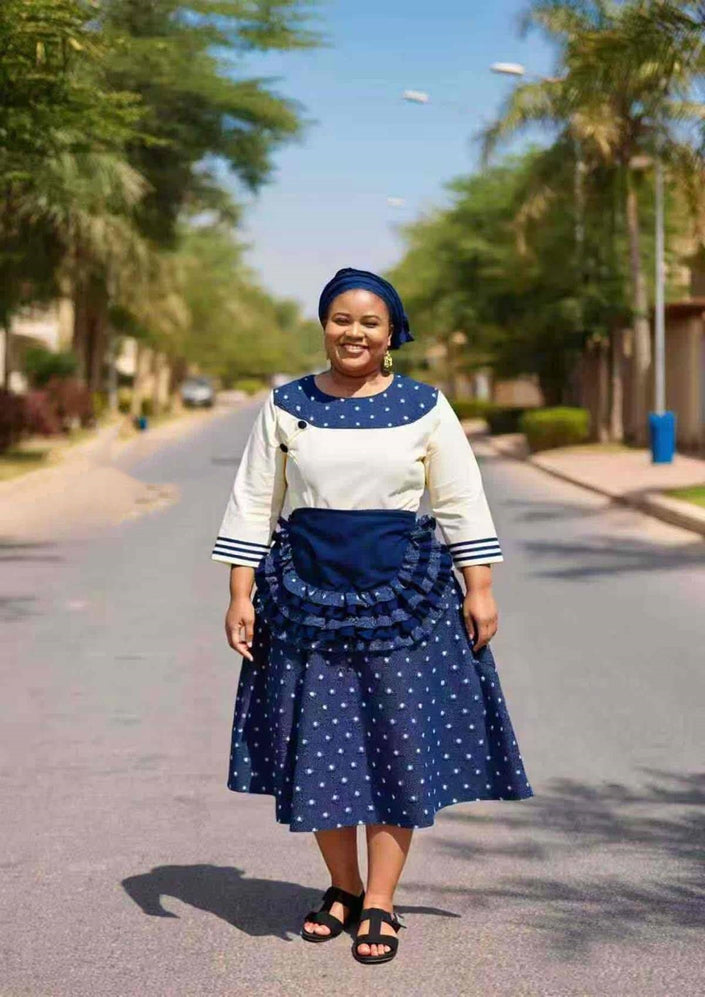 Navy polka dot ruffle midi dress with cream sleeves and tiered skirt