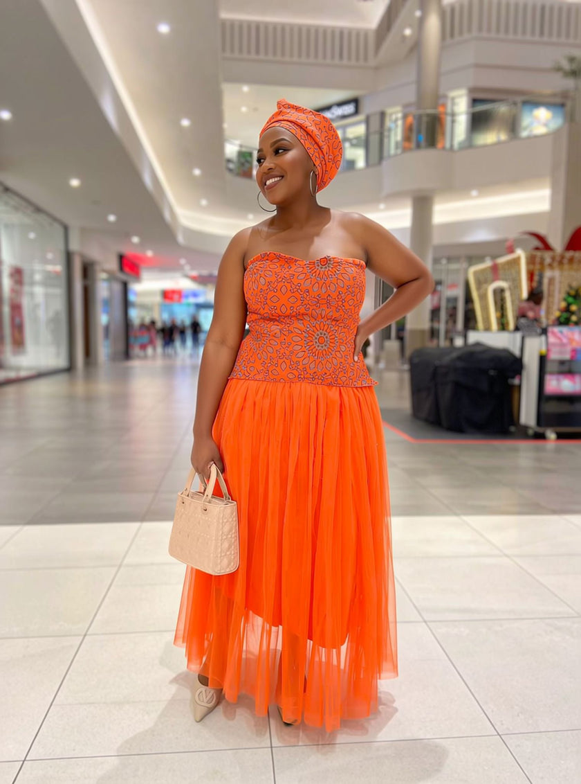 Vibrant orange traditional women's two piece set with matching headwrap