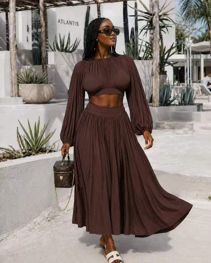 Two-piece dress set with flowing skirt, long sleeves and fitted midriff top, dark brown