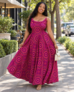Sleeveless magenta maxi dress with a geometric circular print, square neckline, and flowing skirt