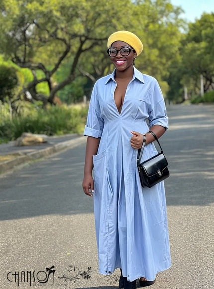 Blue maxi shirt dress with V-neck, long sleeves, and side pockets