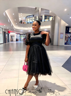 Women’s black midi dress with ruffle sleeves, waist tie, and layered tulle skirt