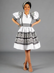 White puff-sleeve traditional dress with black-and-white striped trim and tiered skirt