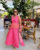 Traditional maxi dress with vibrant pink and orange print, sleeveless with flared skirt
