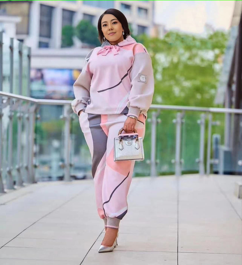 Pink ruffle-hoodie and striped trouser set with drawstring cuffs