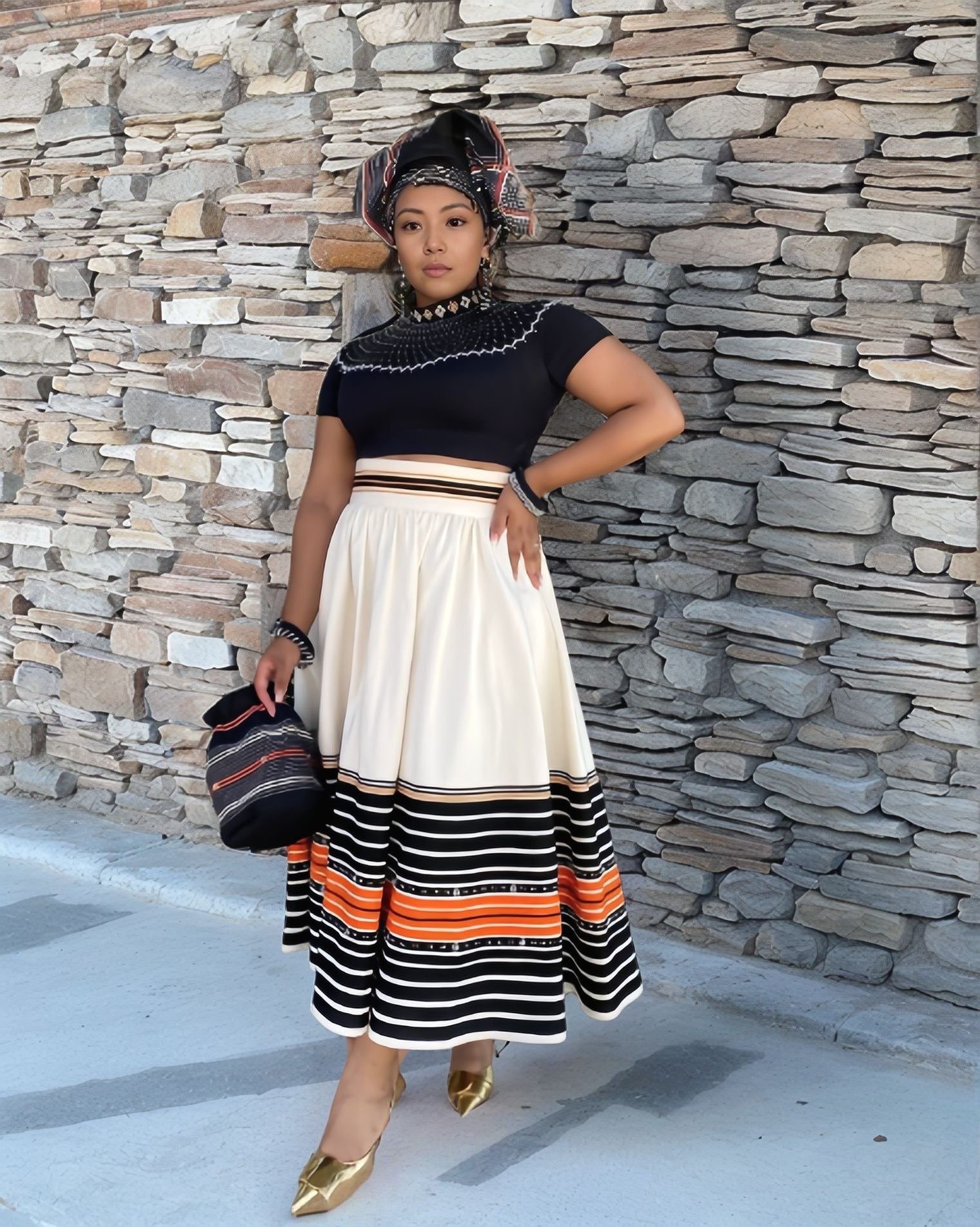 Embroidered pleated midi dress with dark top and cream striped hem, short sleeves
