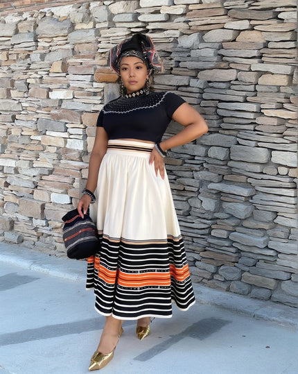 Midi dress: dark short-sleeve top with beaded neckline, striped pleated hem skirt