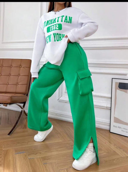 Cropped white sweatshirt with green and teal “Manhattan 1982” “New York” print