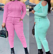 Off-shoulder knit top and high-waist pants in pink and aquamarine, long sleeves