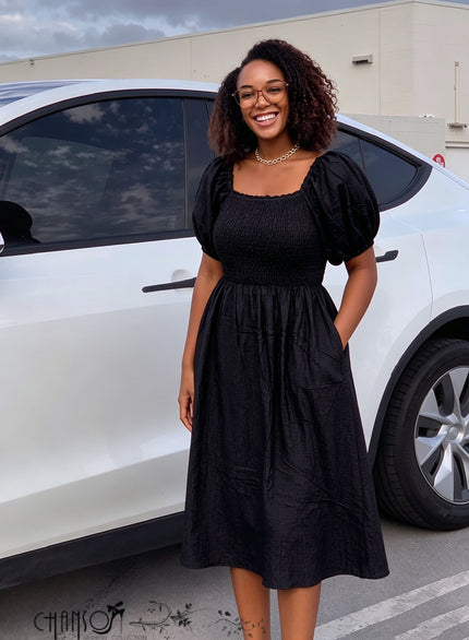 Black denim midi dress with square neck, puff sleeves, smocked waist, gathered skirt