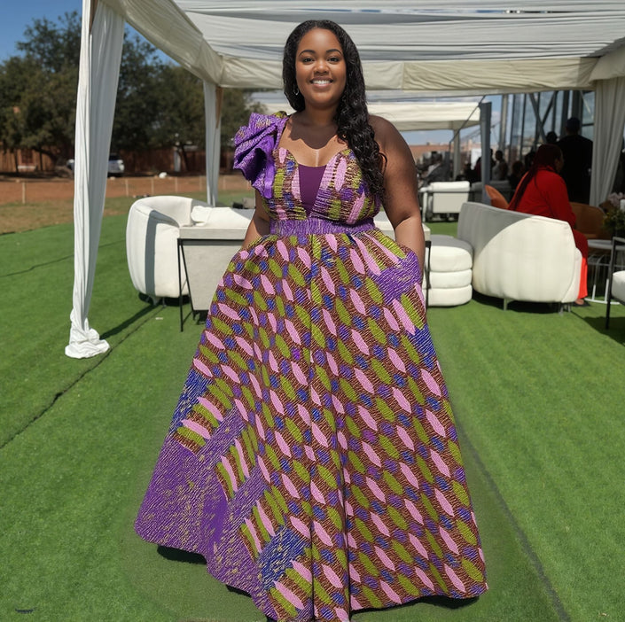 One-shoulder maxi dress with bow detail, purple and multicolor geometric pattern