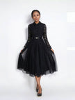 Black lace midi dress with long sleeves, belt, and flared tulle skirt