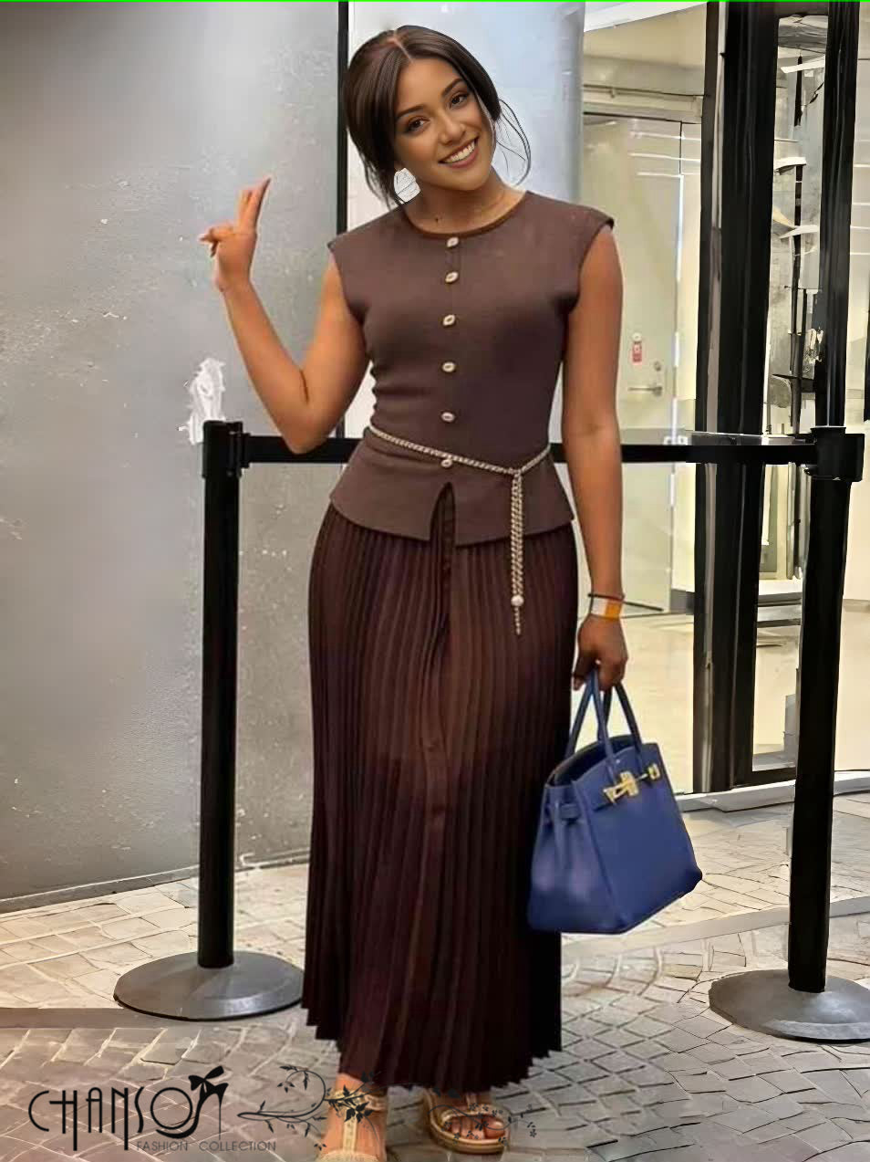 Brown knit midi dress with pleated skirt, sleeveless button front and waist belt