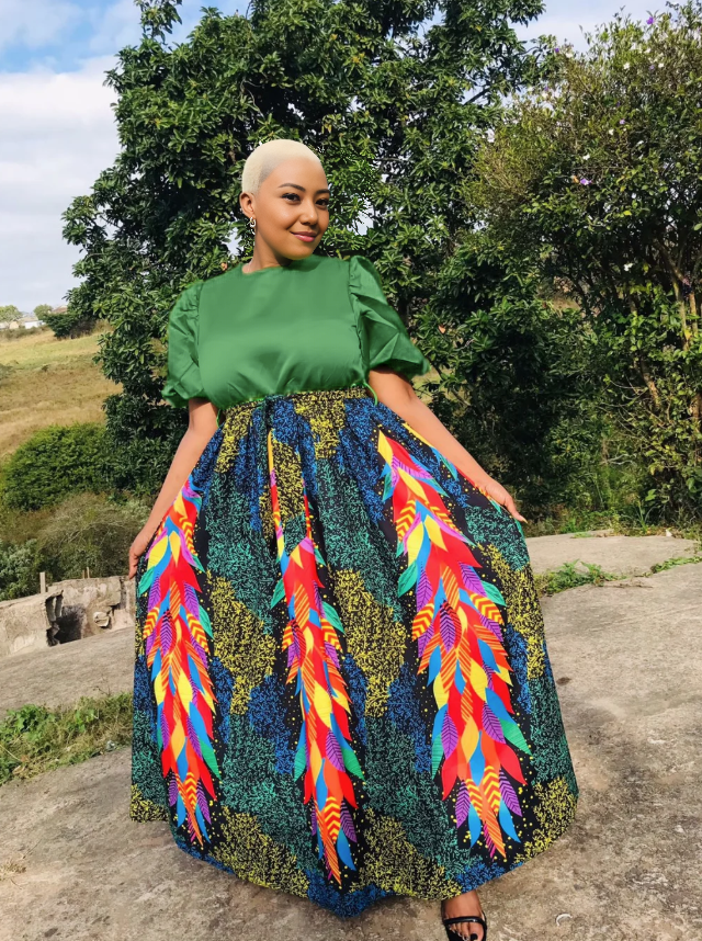 Green top and multicolor feather-print maxi skirt set