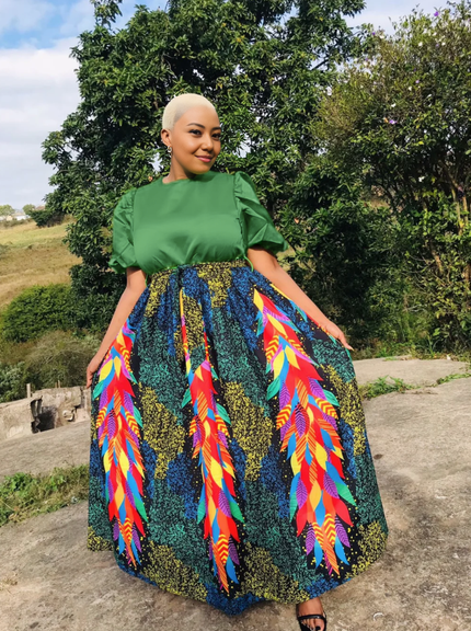 Green top and multicolor feather-print maxi skirt set