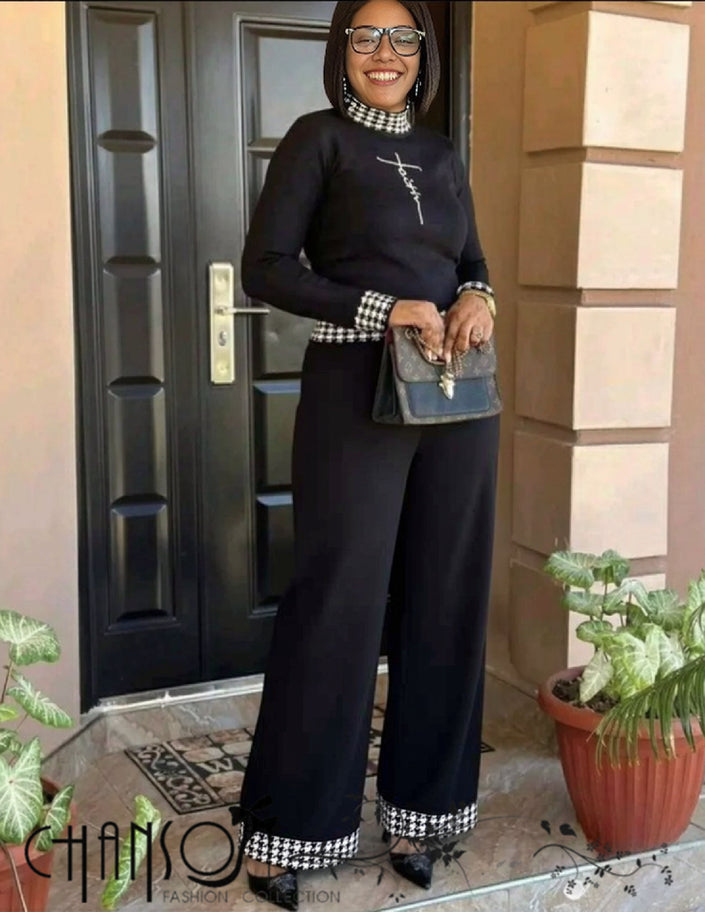 Black knit twin set with houndstooth trim, long-sleeve top and matching wide-leg pants