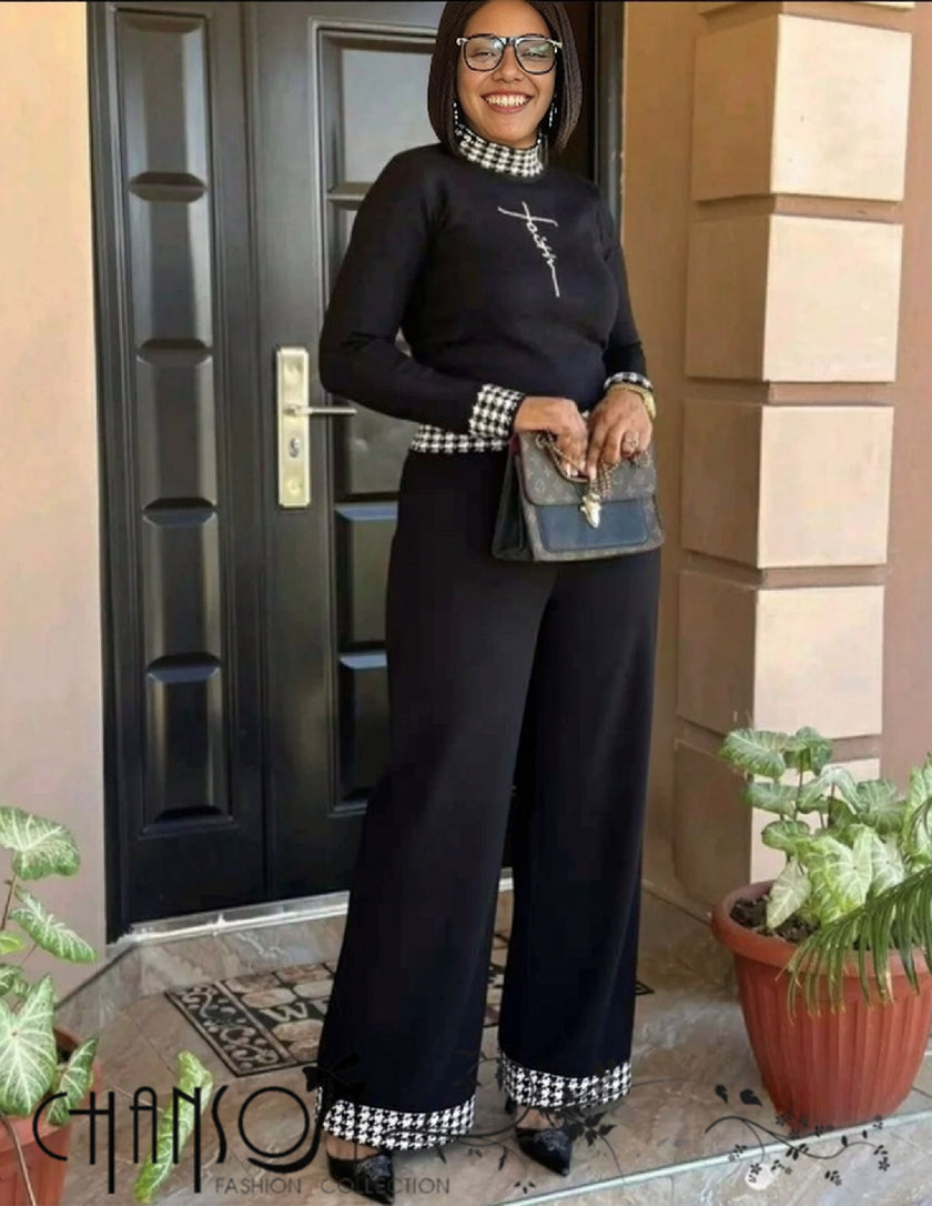 Black knit twin set with houndstooth trim, long sleeves and matching wide-leg pants