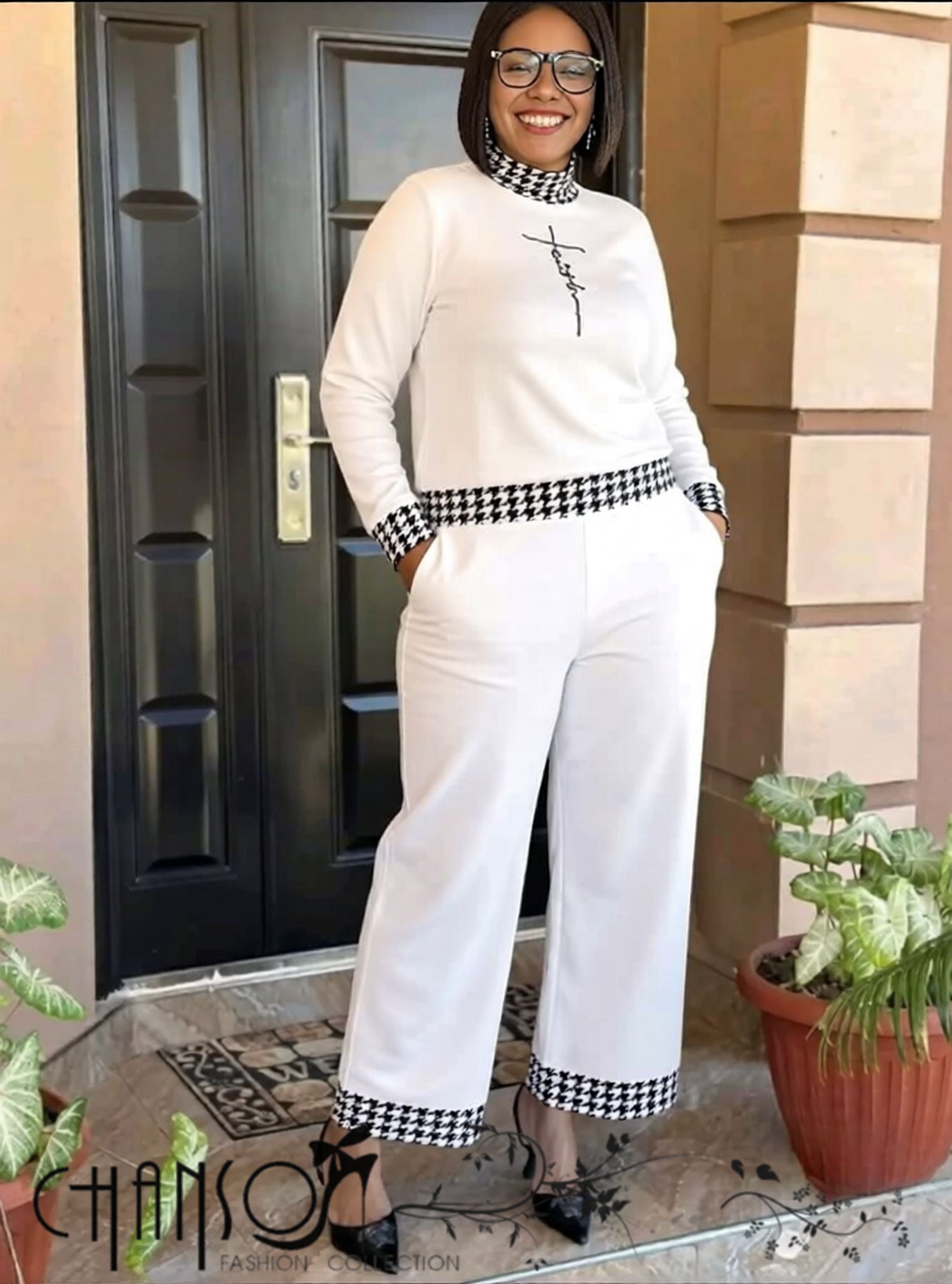 White knit twin set with houndstooth trim, long sleeves and matching wide-leg pants