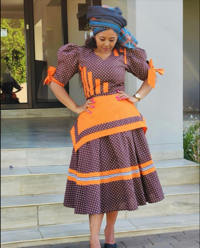 Traditional Dress with Bow Sleeve Accents and Striped Hem
