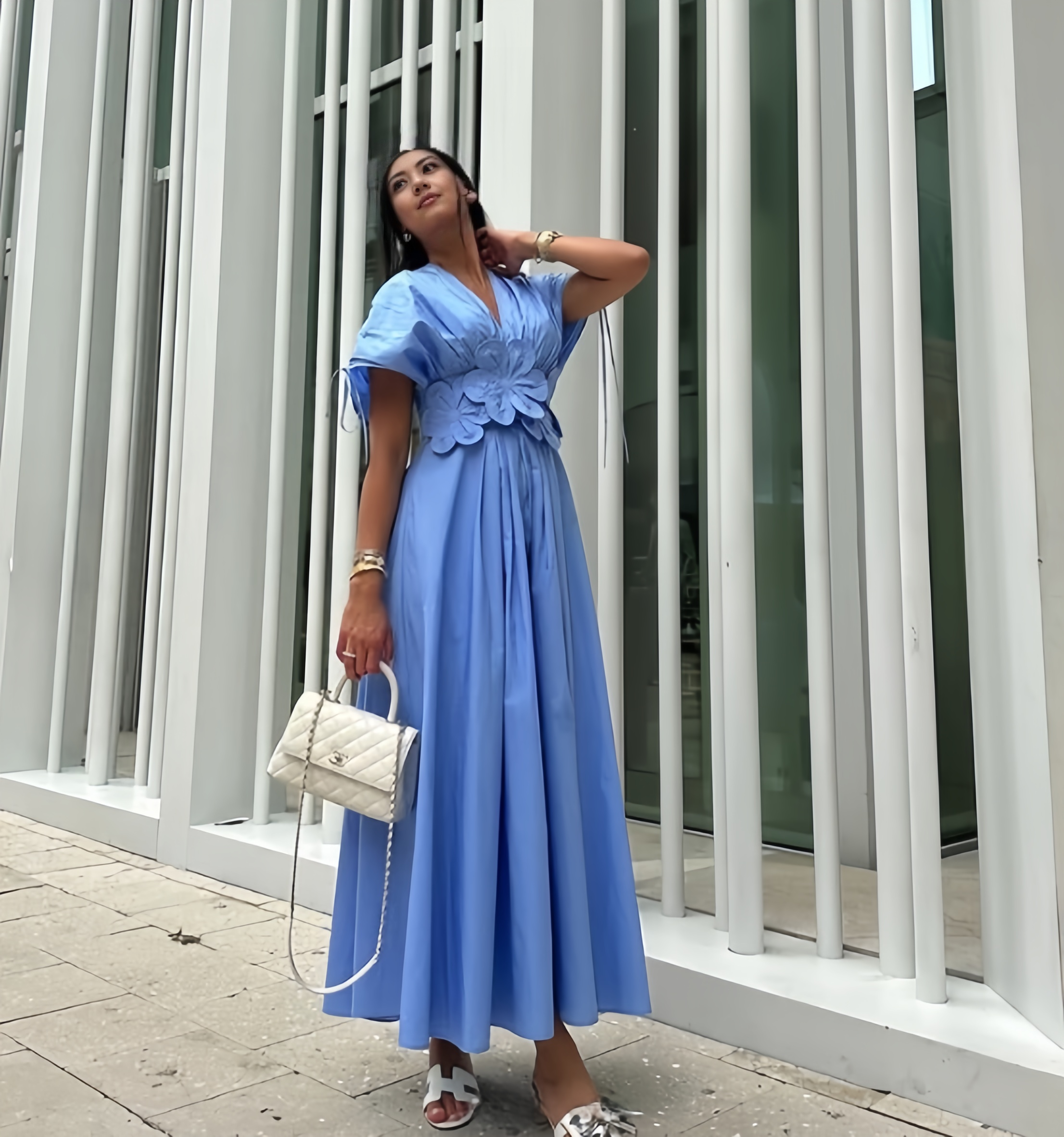 Sky-blue floral maxi dress with puff sleeves and A-line skirt, V-neck.