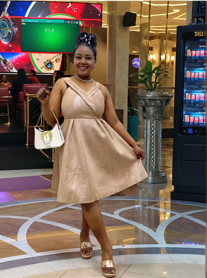 Gold glitter A-line dress with sleeveless V-neck and gathered waist
