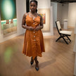 Rust orange sleeveless A-line midi dress with button placket and waist belt