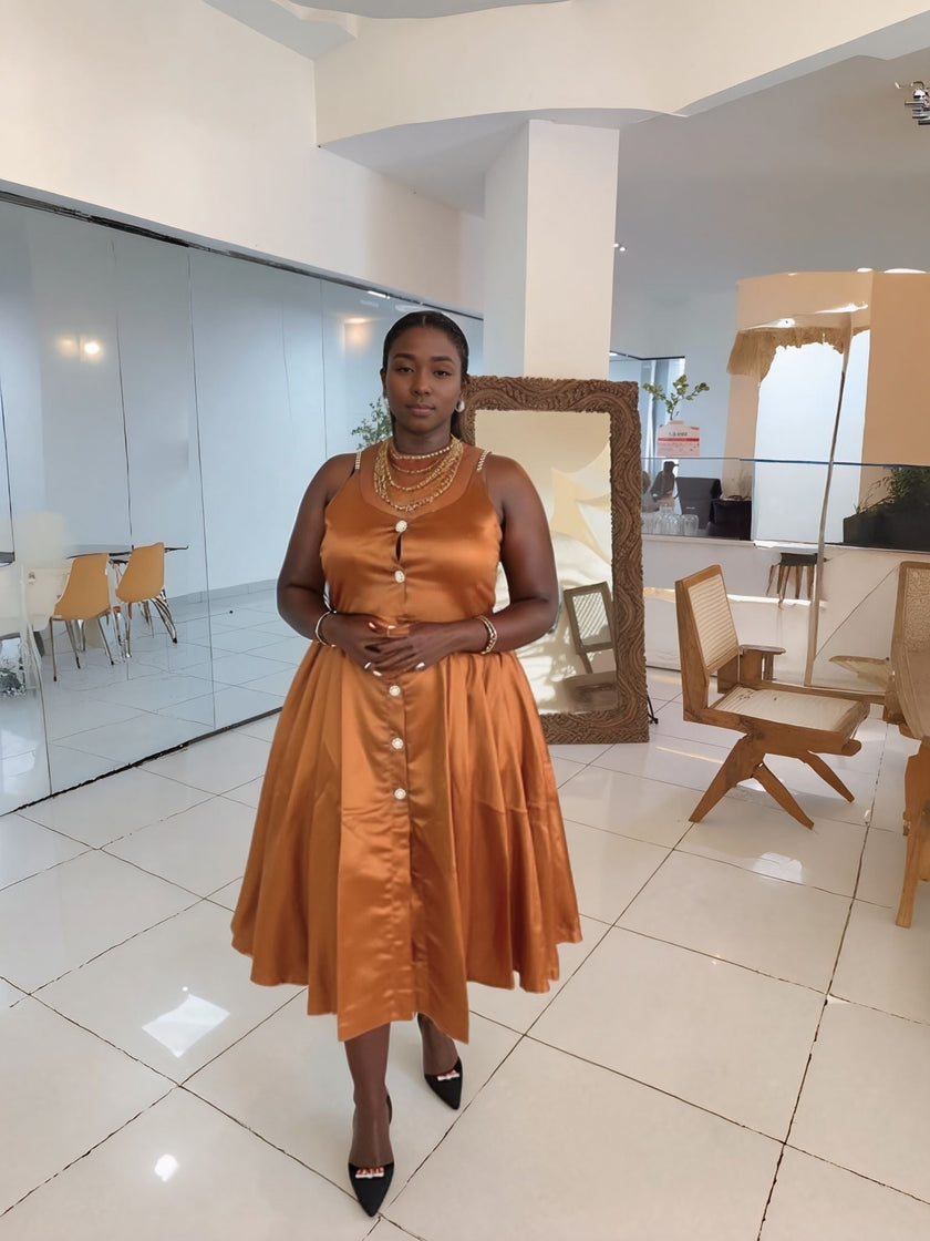 Orange-brown sleeveless A-line midi dress with button front and waist belt