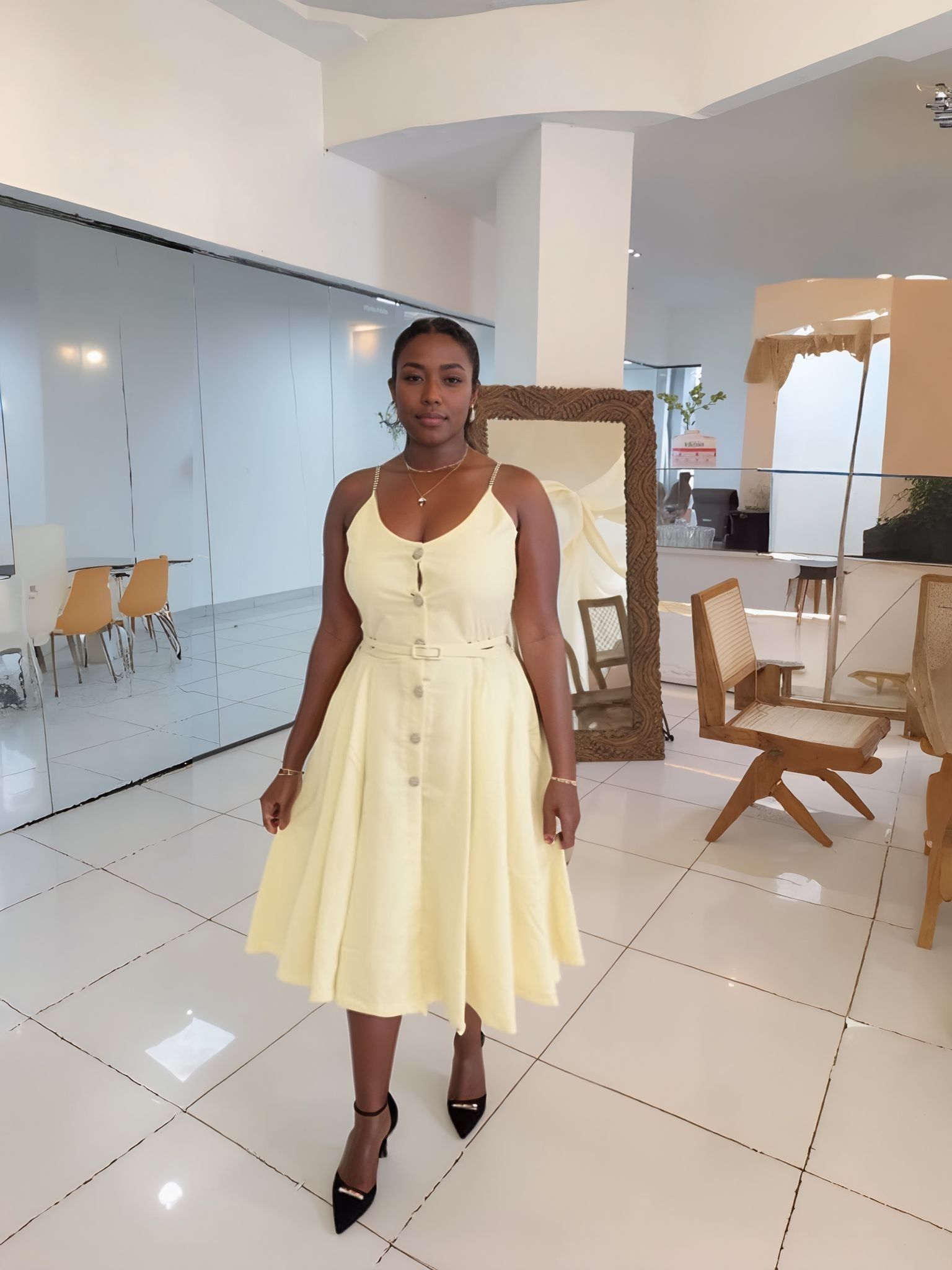 Cream sleeveless A-line midi dress with button front and waist belt