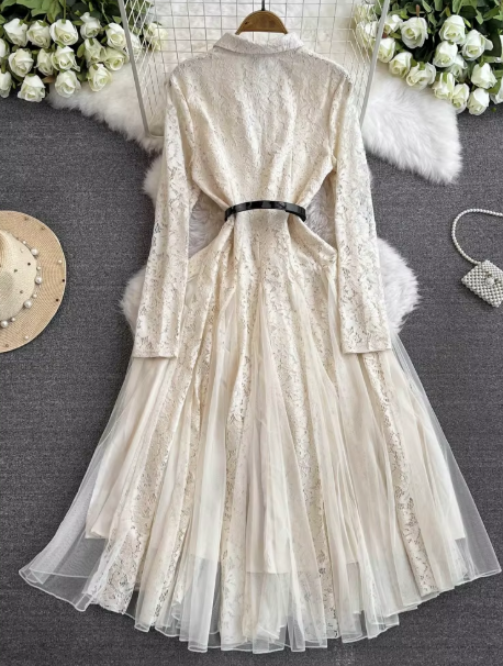 White lace midi dress with long sleeves, belt, and layered tulle flared skirt